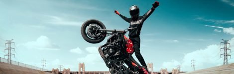 moto-rider-making-stunt-his-motorbike-biker-doing-difficult-dangerous-stunt