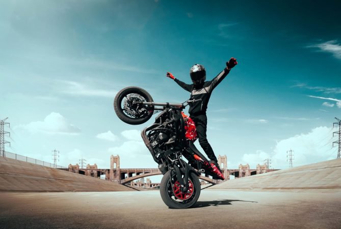 moto-rider-making-stunt-his-motorbike-biker-doing-difficult-dangerous-stunt